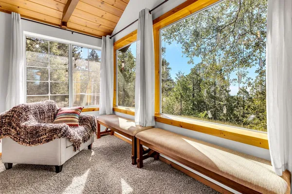 a living room with couch and a window