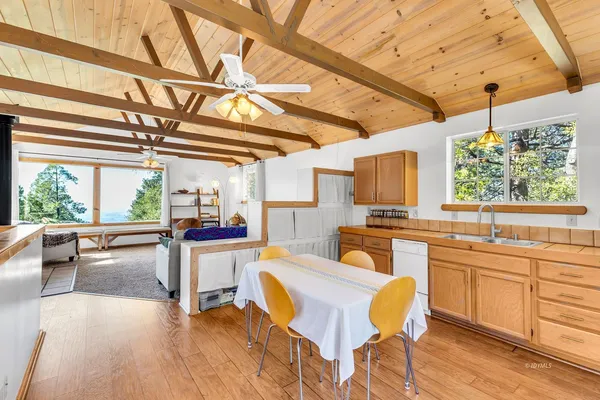a kitchen with a sink and wooden cabinets