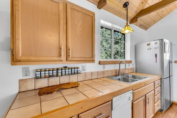 a kitchen with a sink and a refrigerator