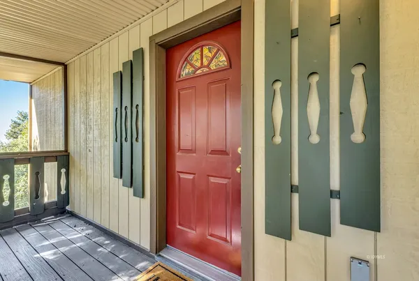 a view of balcony with wooden floor