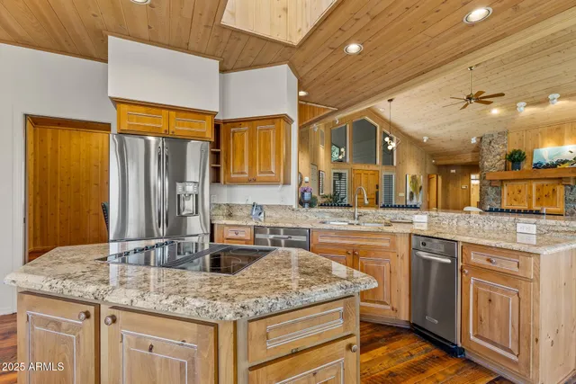 a dinning area with pool table and chairs