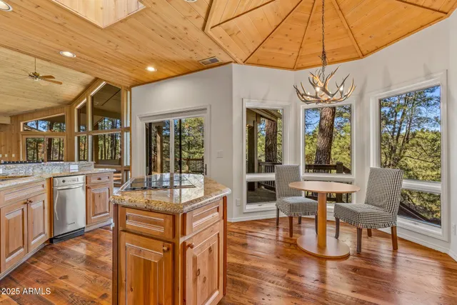 a kitchen with stainless steel appliances granite countertop a sink and cabinets