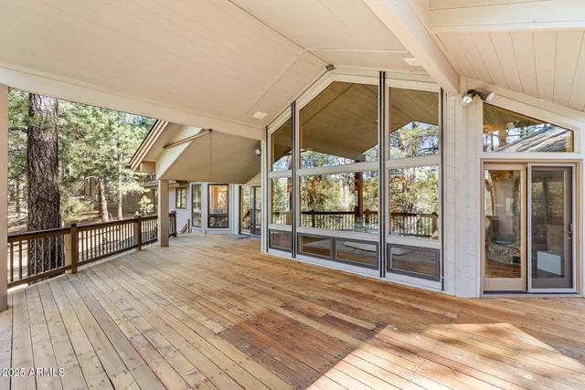 a view of a porch with wooden floor and outdoor space