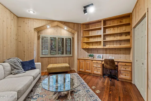 a view of entryway with wooden floor and stairs