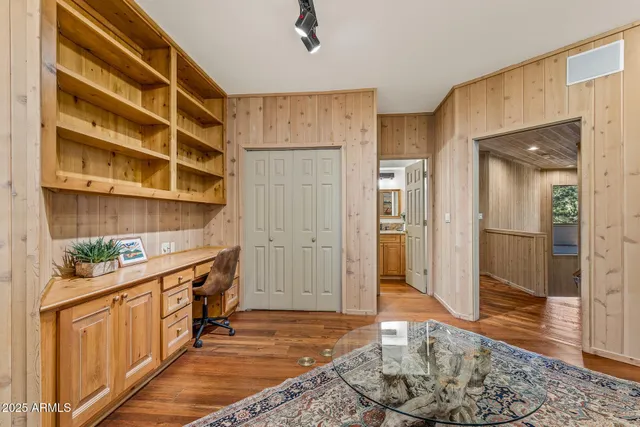 a bedroom with a bed and a night stand