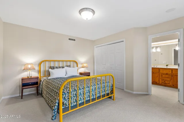 a bedroom with a bed and a couch