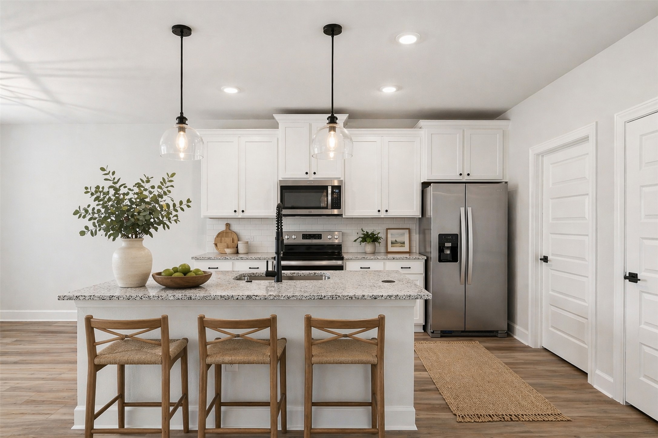 9320 Gladsome Path Manor, TX 78653 - Photo 4 of 34 a kitchen with refrigerator and cabinets