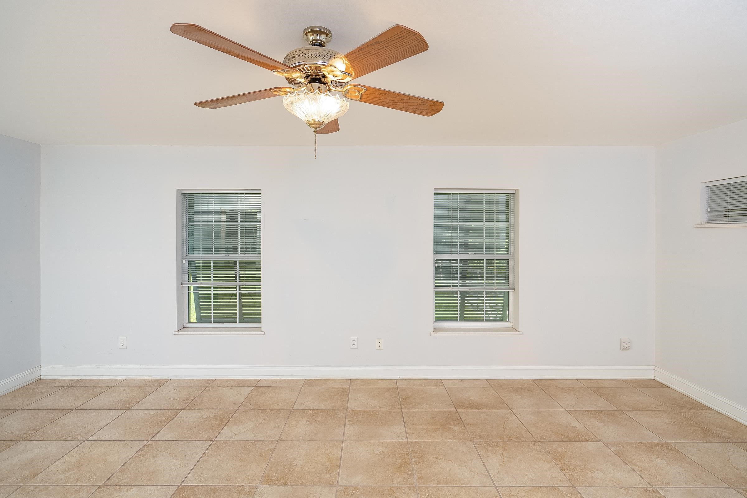5035 Scaff Road St. Augustine, FL 32092 - Photo 23 of 56 an empty room with windows and fan