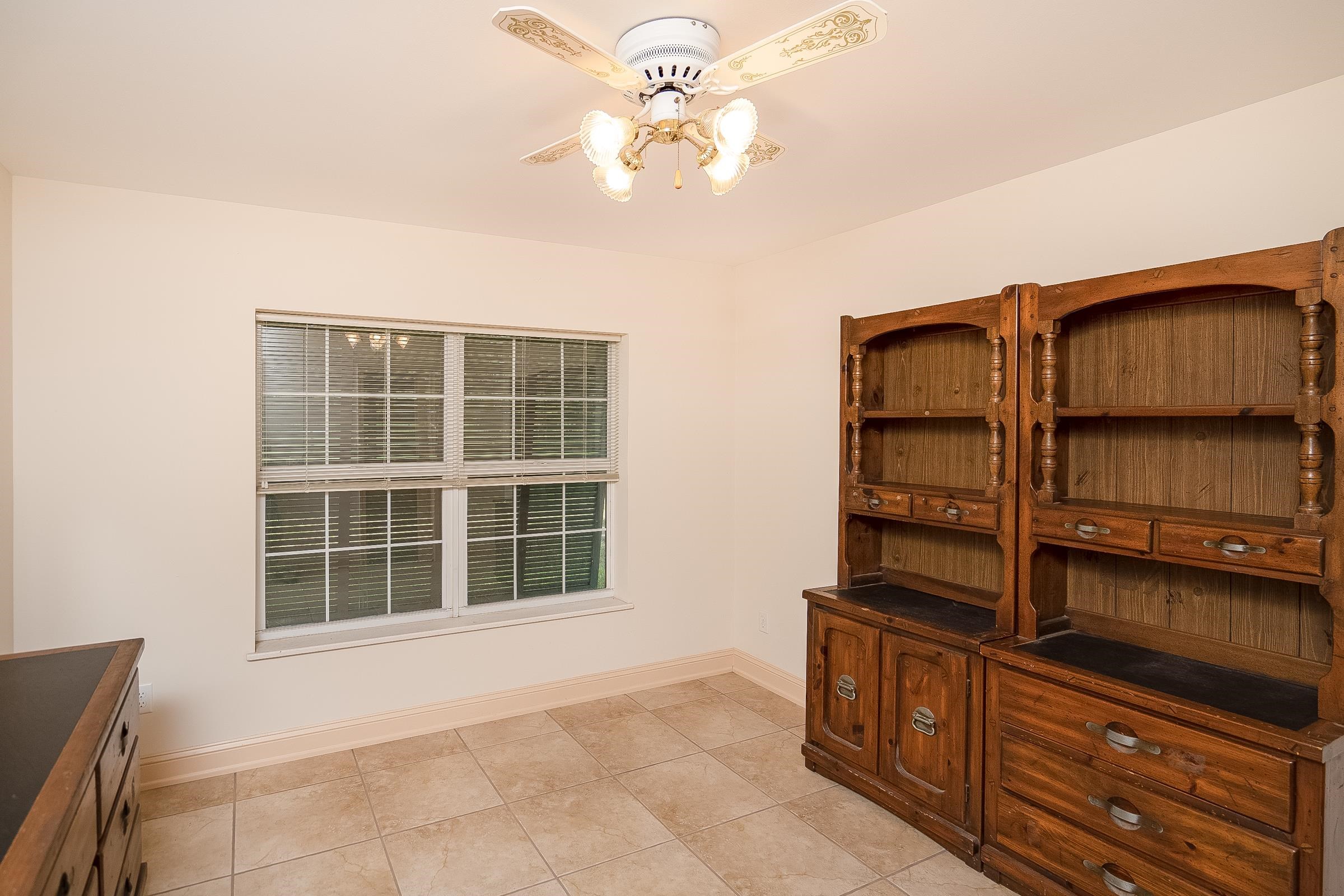5035 Scaff Road St. Augustine, FL 32092 - Photo 27 of 56 a view of a bedroom with cabinet and balcony