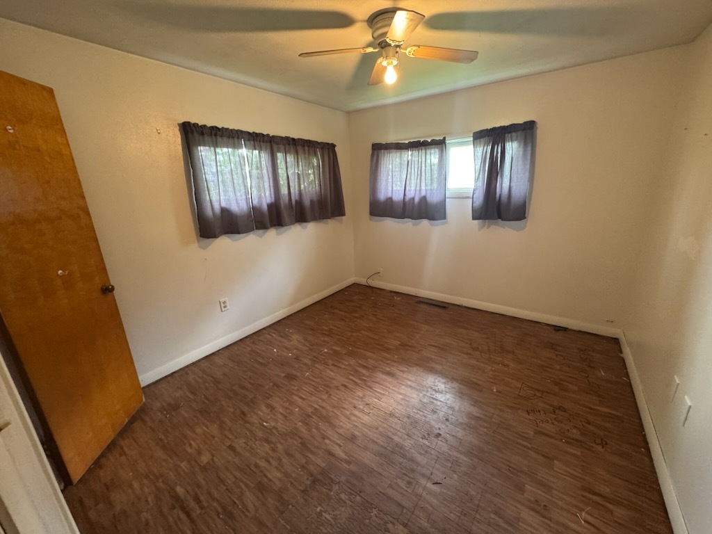 2102 French Street Rock Falls, IL 61071 - Photo 9 of 10 a view of an empty room with wooden floor and a window