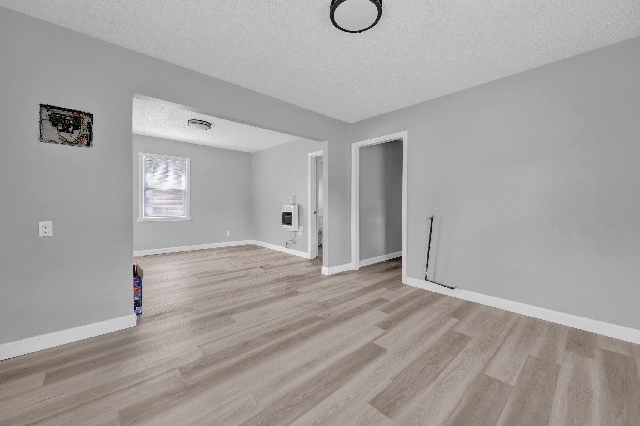 160 Silverage Avenue Memphis, TN 38109 - Photo 6 of 11 Unfurnished living room with light wood-type flooring and heating unit