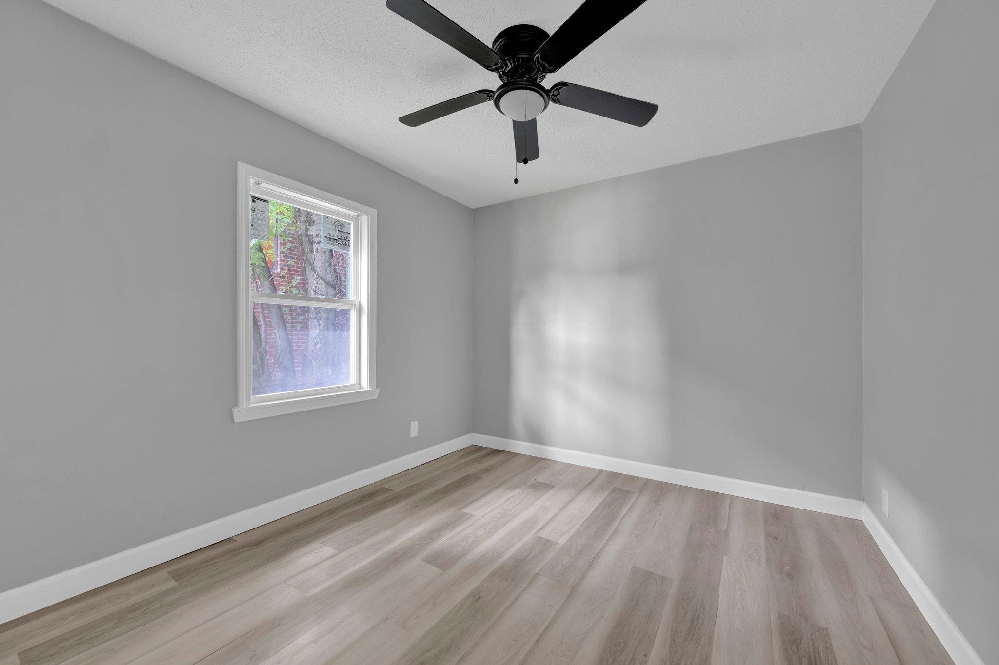 160 Silverage Avenue Memphis, TN 38109 - Photo 10 of 11 Spare room with light wood-style floors and ceiling fan