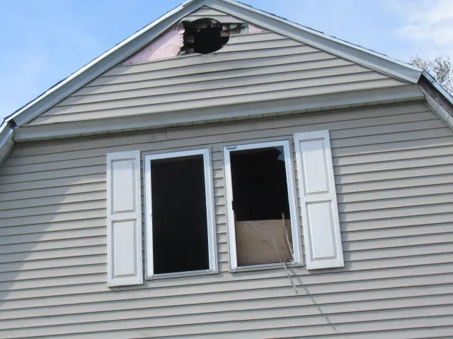 a view of a backyard with sitting area