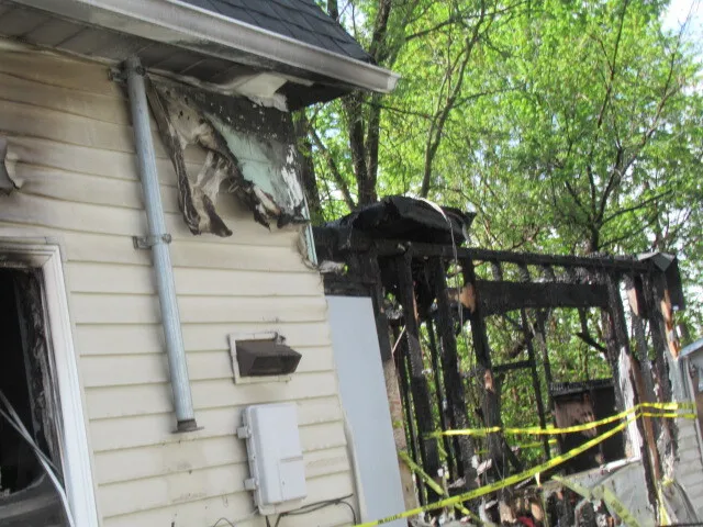 a view of a chairs and table in backyard