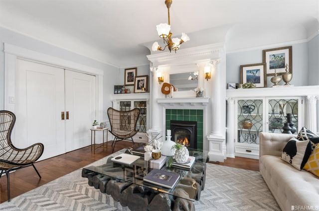 a view of a living room with furniture and a window