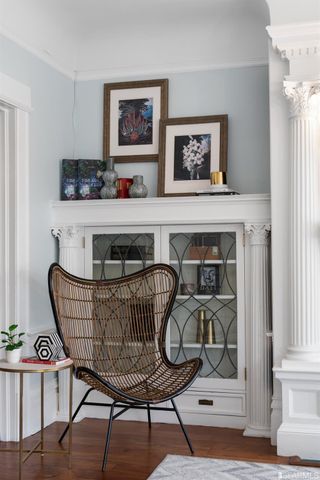 a living room with furniture and large windows