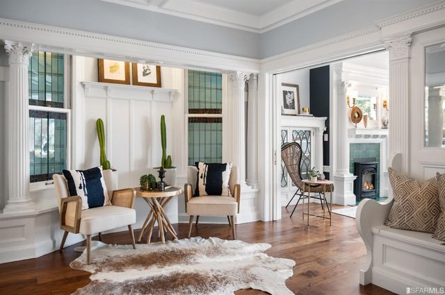 a view of a dining room with furniture window and wooden floor