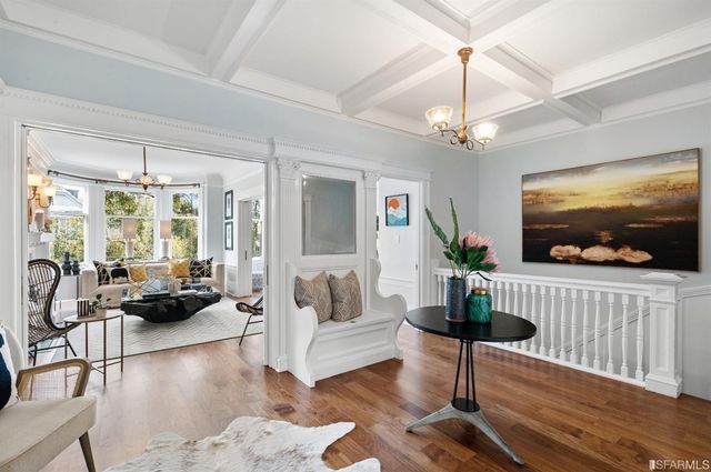 a view of a livingroom with furniture and a table