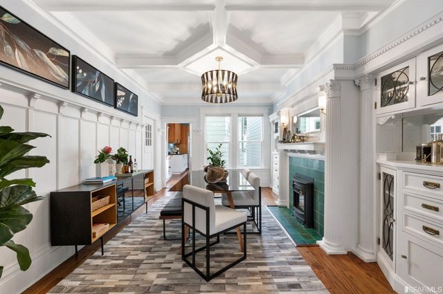 a kitchen with stainless steel appliances granite countertop sink stove top oven and cabinets