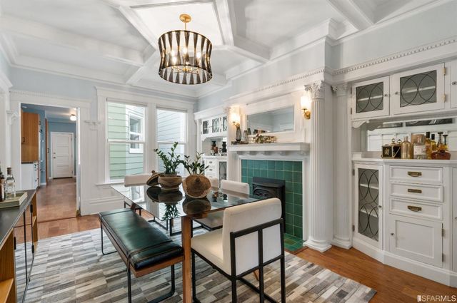 a kitchen with stainless steel appliances granite countertop a refrigerator a sink dishwasher and a stove with wooden floor