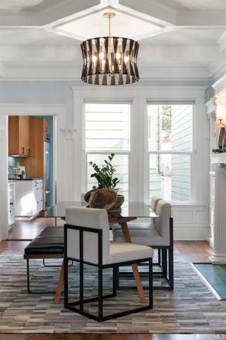 a living room with a large window and a table