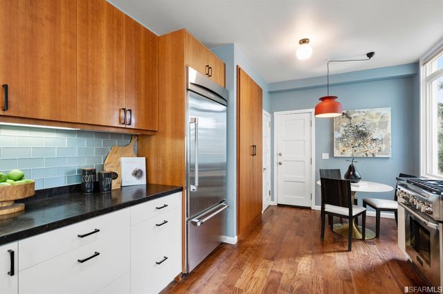 a bedroom with a large bed and a large window