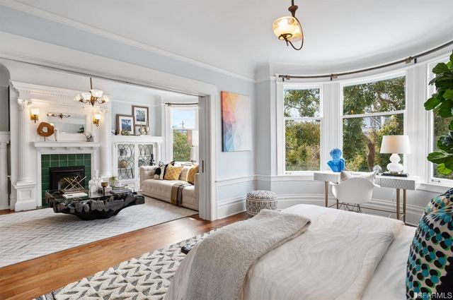 a bedroom with a bed and cupboard