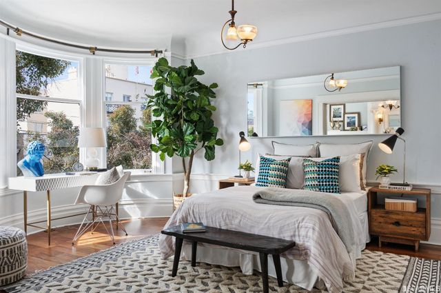 a bathroom with a double vanity sink mirror and bathtub