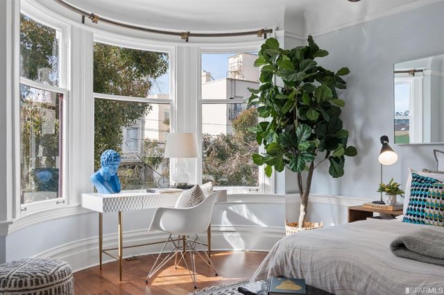 a view of a patio with couches table and chairs and potted plants