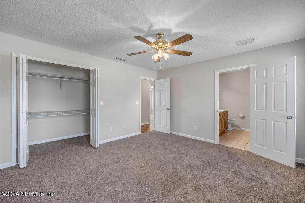 3308 Thunder Road Middleburg, FL 32068 - Photo 16 of 39 a view of an empty room and a ceiling fan
