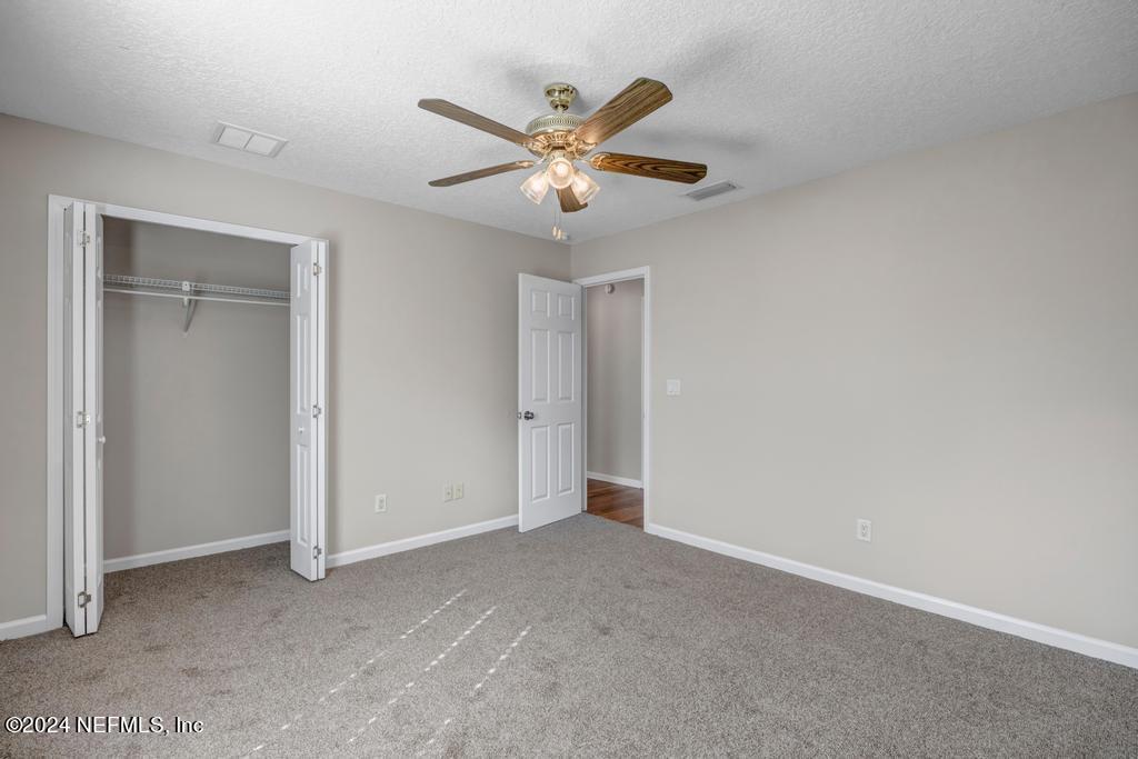 3308 Thunder Road Middleburg, FL 32068 - Photo 21 of 39 a view of an empty room with a ceiling fan