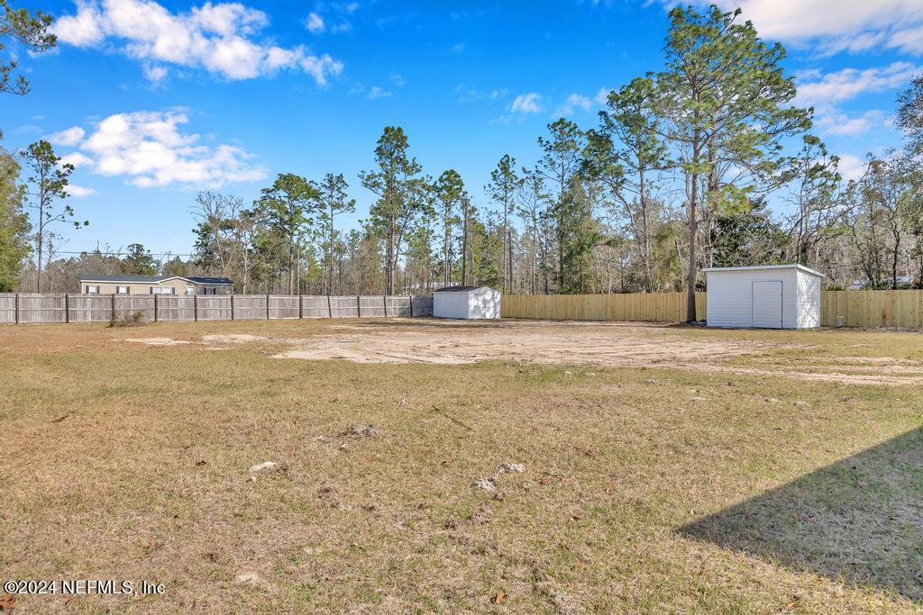 3308 Thunder Road Middleburg, FL 32068 - Photo 26 of 39 a view of an outdoor space and a yard