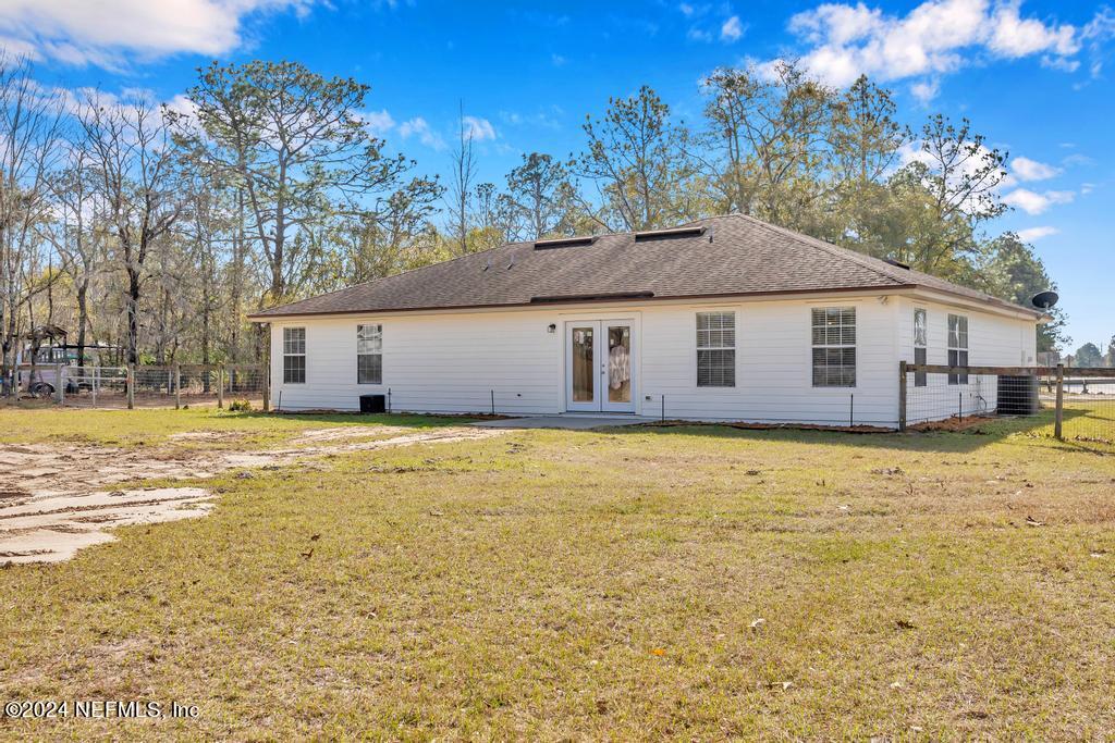3308 Thunder Road Middleburg, FL 32068 - Photo 27 of 39 a front view of a house with a yard