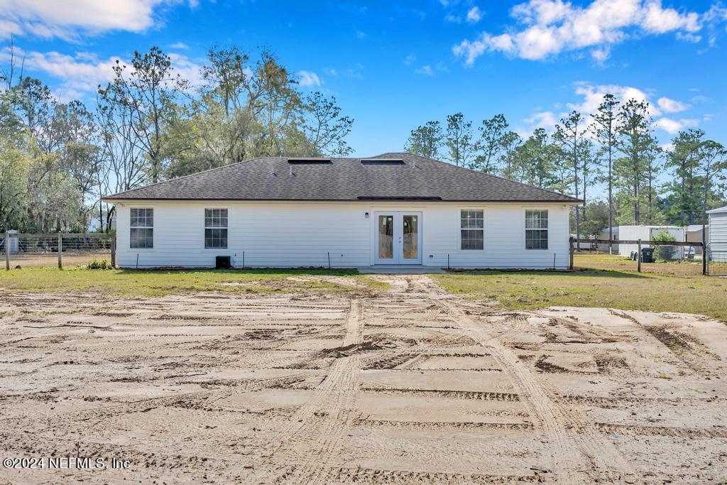 3308 Thunder Road Middleburg, FL 32068 - Photo 29 of 39 a view of a house with a yard