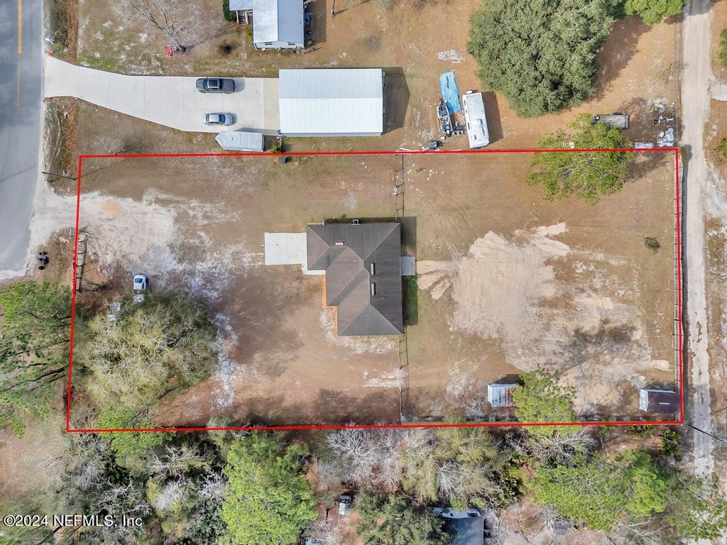 3308 Thunder Road Middleburg, FL 32068 - Photo 33 of 39 an aerial view of a houses with yard