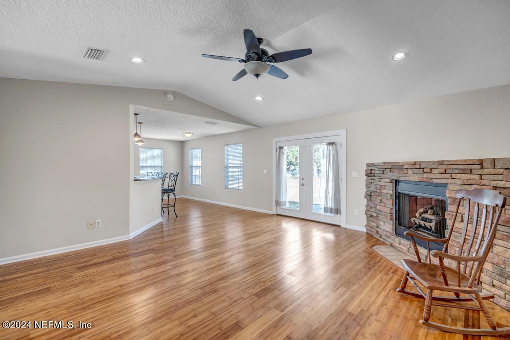 3308 Thunder Road Middleburg, FL 32068 - Photo 6 of 39 a view of a livingroom with furniture and a fireplace