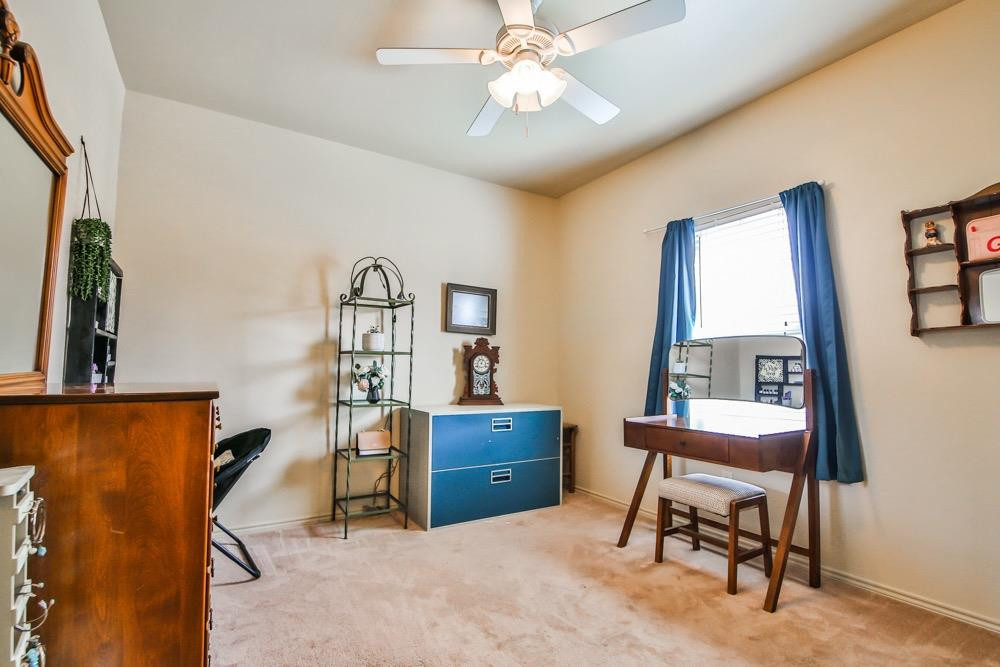 3118 113th Street Lubbock, TX 79423 - Photo 18 of 24 a workspace with furniture and window