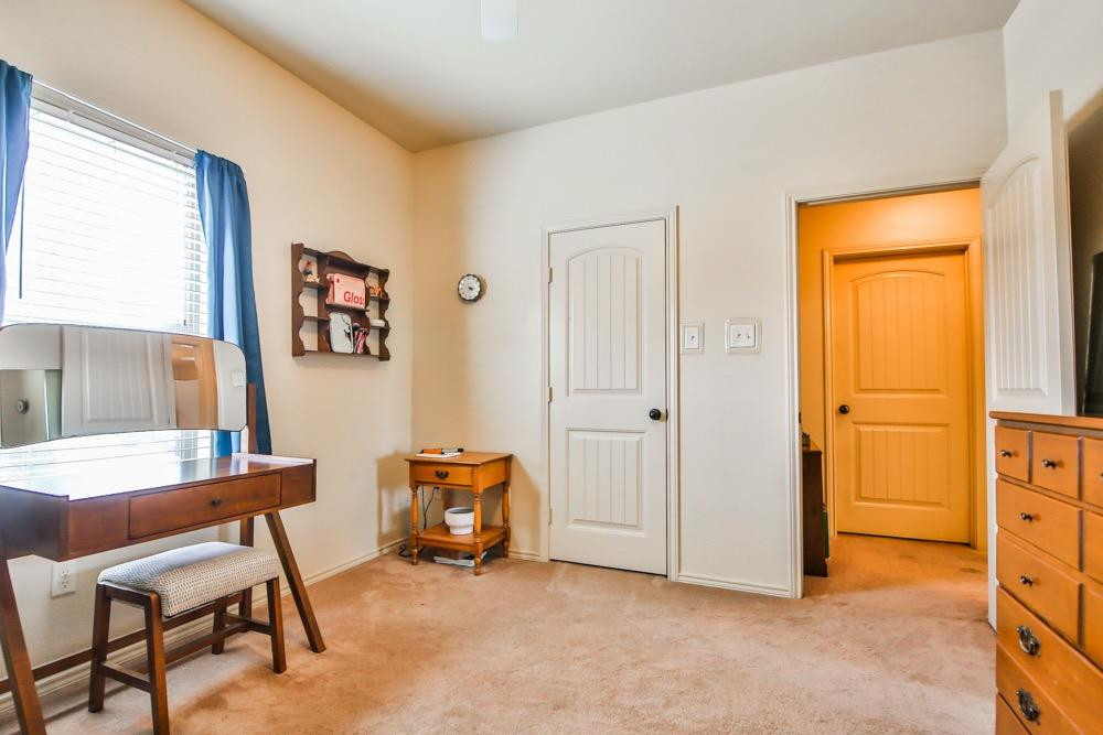3118 113th Street Lubbock, TX 79423 - Photo 20 of 24 a view of a livingroom with furniture and a window