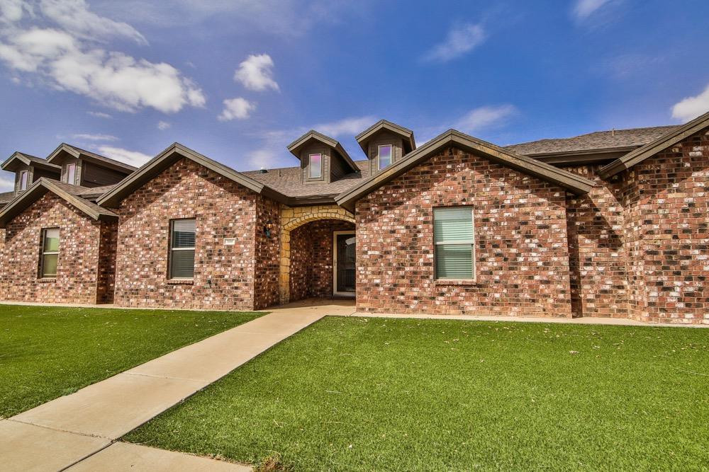 3118 113th Street Lubbock, TX 79423 - Photo 2 of 24 a front view of a house with garden