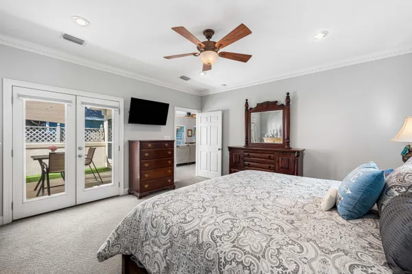 a bathroom with a granite countertop tub a double vanity sink a vanity and a large mirror