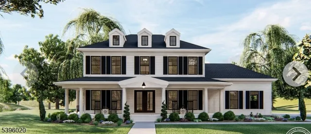 a front view of a residential apartment building with a yard