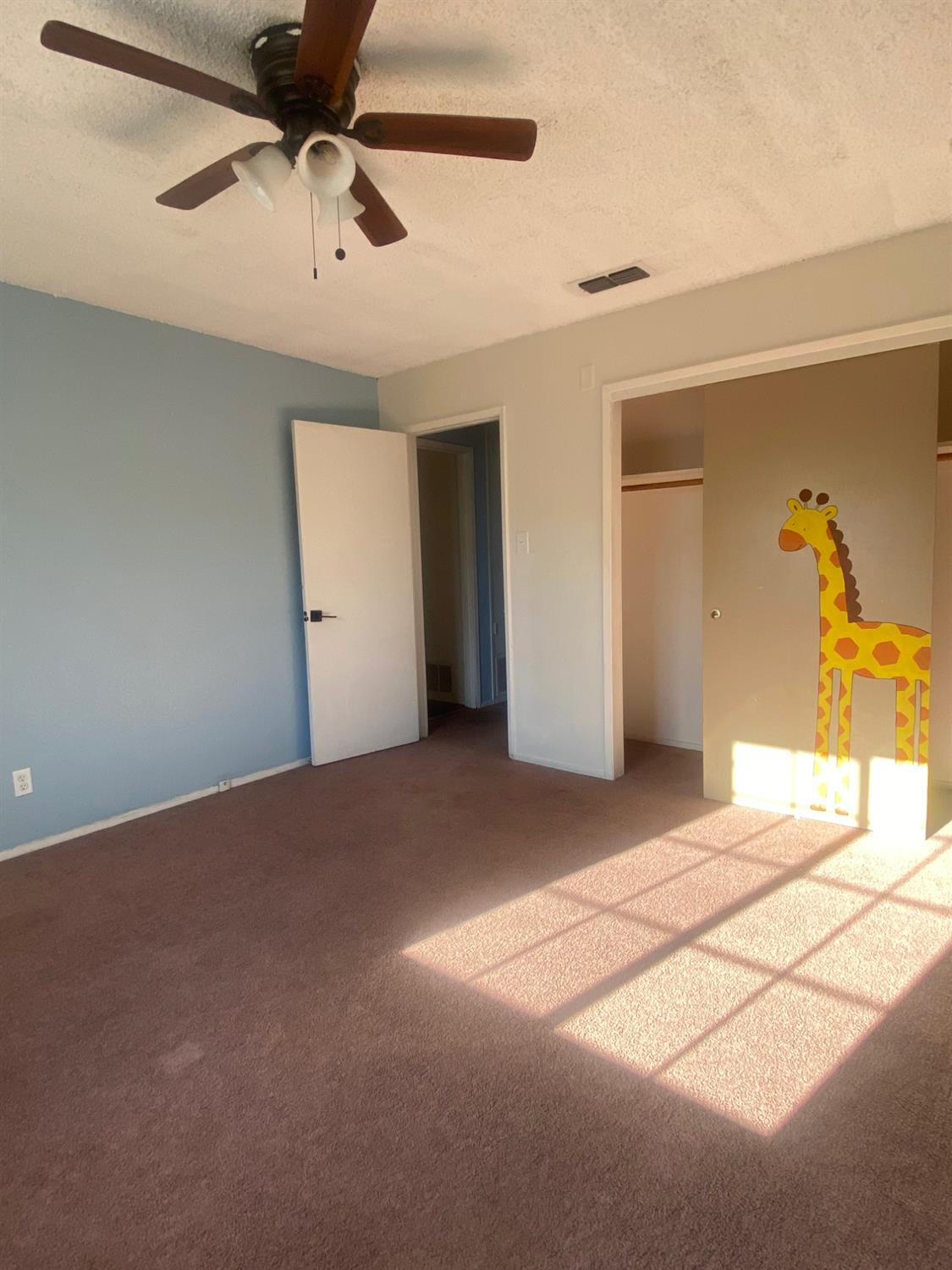 333 East Linden Avenue Reedley, CA 93654 - Photo 12 of 21 a view of a room with a ceiling fan