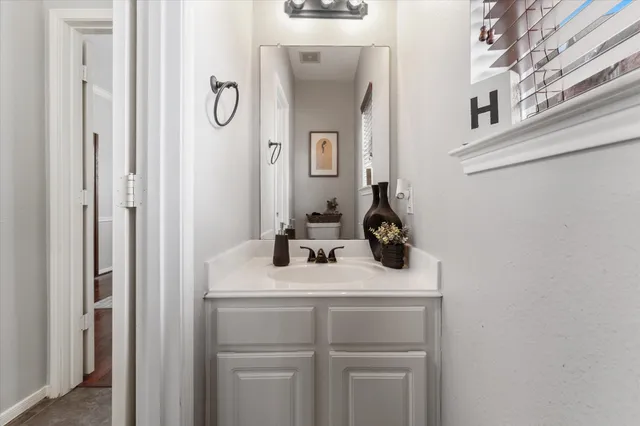 a bathroom with a sink and mirror