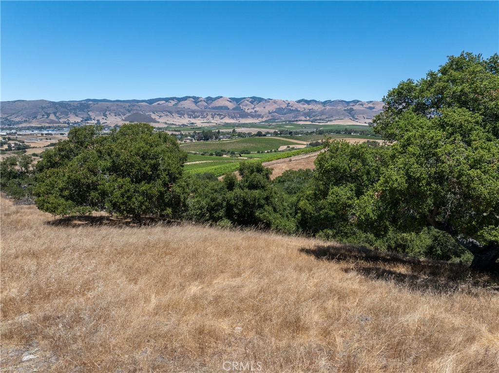 5502 Los Ranchos Road San Luis Obispo, CA 93401 - Photo 17 of 75 an aerial view of a houses with a yard and mountain view in back