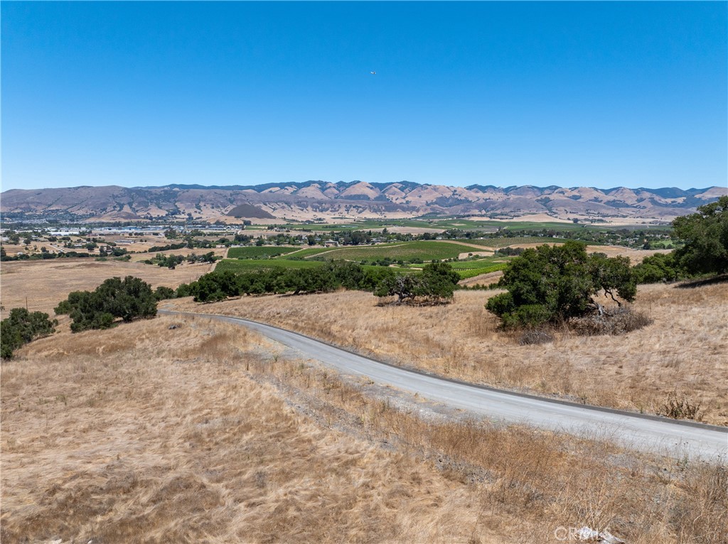 5502 Los Ranchos Road San Luis Obispo, CA 93401 - Photo 18 of 75 a view of a lake with mountains in the background