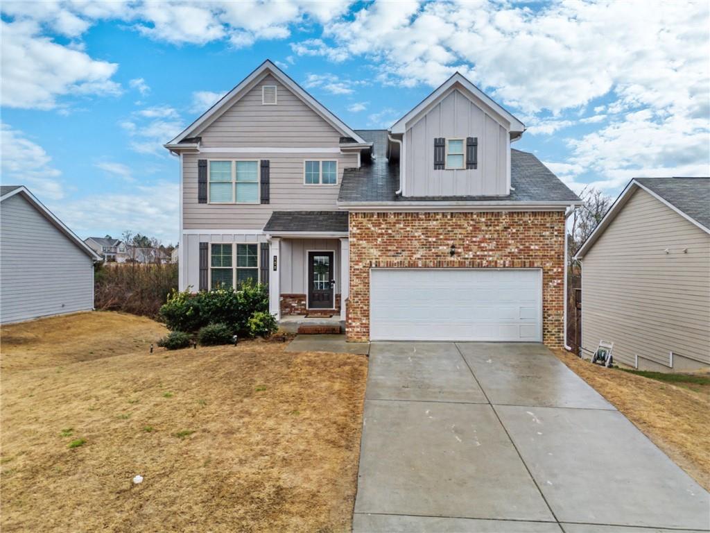 108 Mcginnis Circle Calhoun, GA 30701 - Photo 1 of 56 a front view of a house with a yard and garage