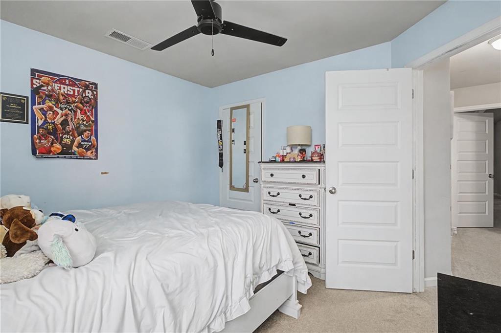 108 Mcginnis Circle Calhoun, GA 30701 - Photo 26 of 56 a bedroom with a bed and a cabinets