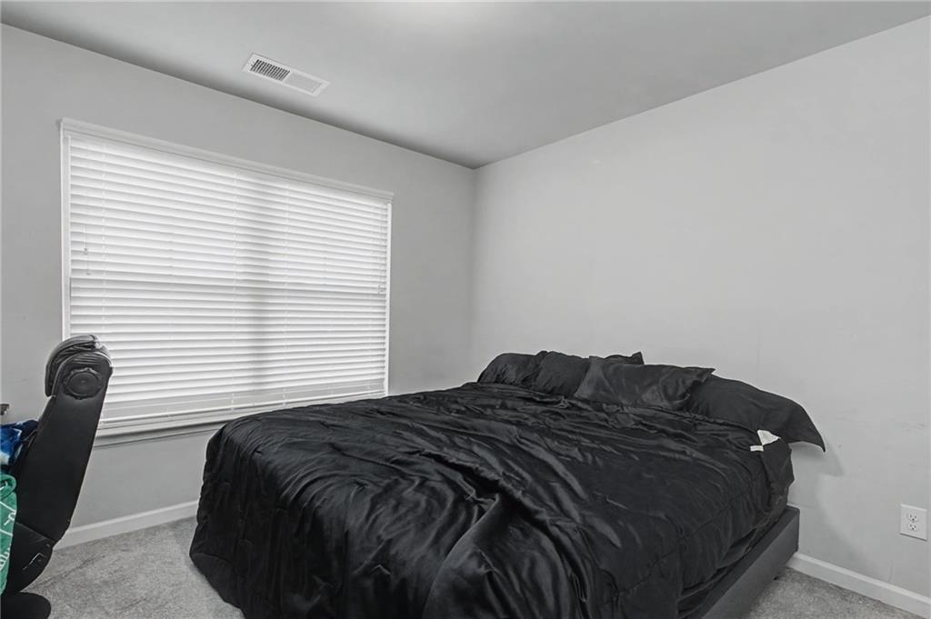 108 Mcginnis Circle Calhoun, GA 30701 - Photo 29 of 56 a bedroom with a bed and a window