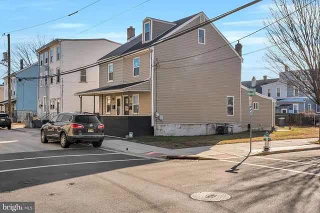 a view of a car parked in front of a house