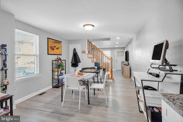 a view of a livingroom with furniture and a wooden floor